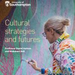 Cultural strtegies and futures front cover . A woman with hair tied back, wearing specs and a colourful jacket painting a mural.